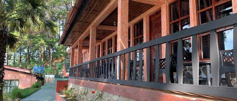 A building with a stone foundation and a wooden upper structure.