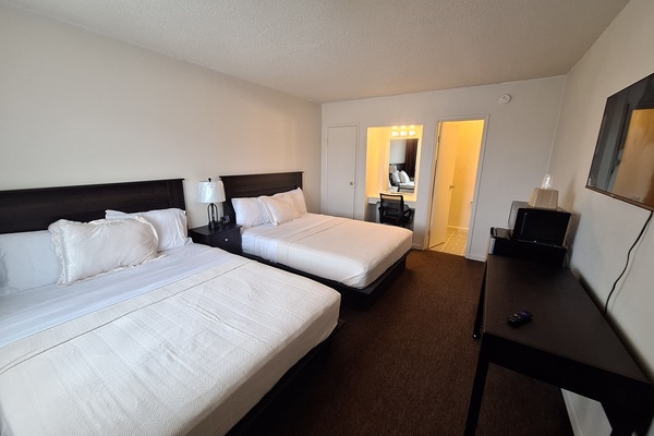 Deluxe Double Room, Two Queen Beds, Non-Smoking | Desk, laptop workspace, blackout drapes, free WiFi