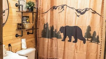 Shower, hair dryer, towels, shampoo