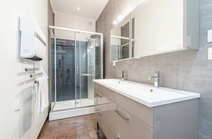 Shower, towels, soap, toilet paper
