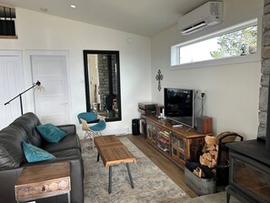 Smart TV, fireplace, books, printers