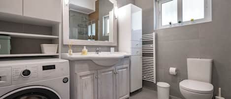 Shower, hair dryer, towels, soap