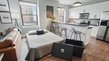 1 bedroom, desk, iron/ironing board, travel crib