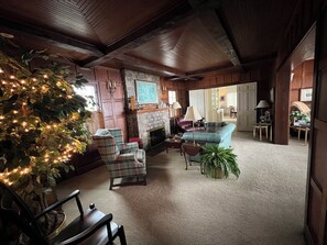 Smart TV, fireplace, books, computer monitors