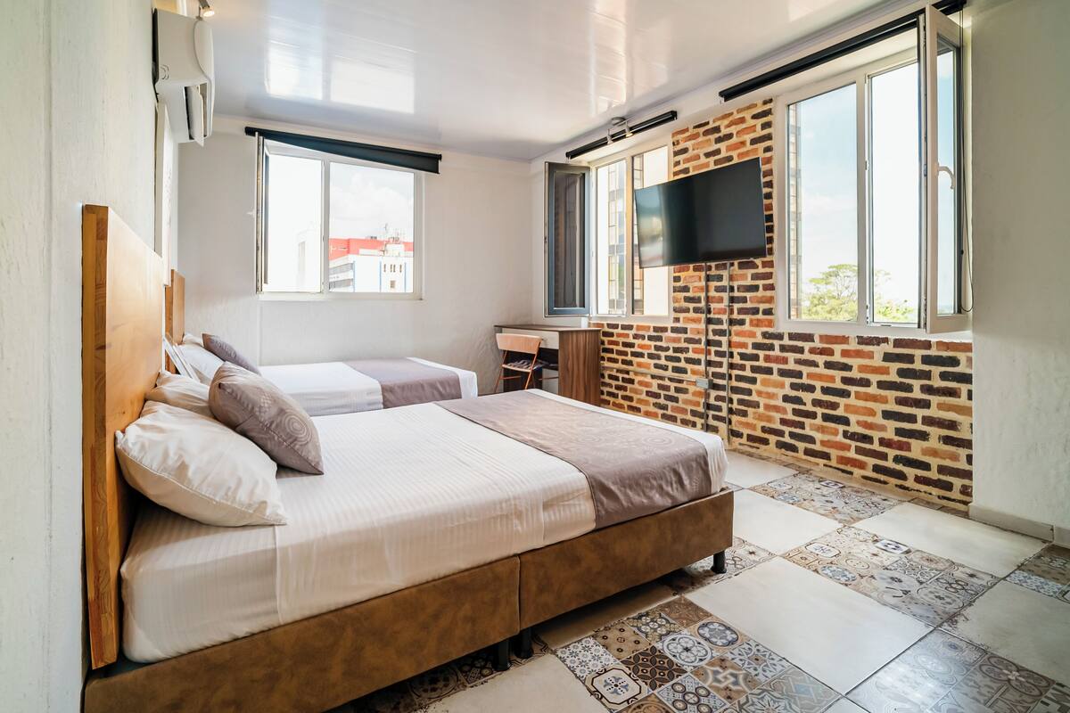 Quadruple Room, City View | Desk, laptop workspace, iron/ironing board (on request), WiFi (free)