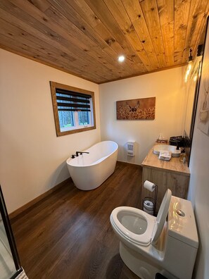 Shower, hair dryer, towels, toilet paper