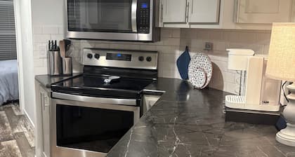 Charming Tiny Home in Conroe with huge patio +grill & lots of green space.