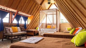 A cozy, wooden-roofed room with a bed, a wooden bench, and a small table.
