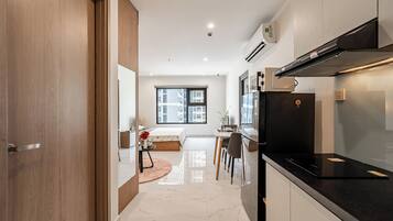 Apartment, 1 Bedroom, Air conditioning, City View | Pillow-top beds, minibar, individually furnished, blackout curtains