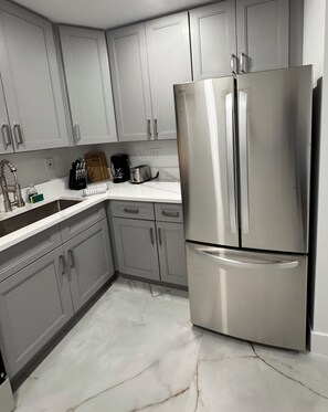 Fridge, microwave, stovetop, coffee/tea maker