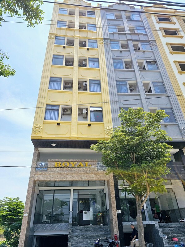 A multi-story hotel with a prominent 'ROYAL' sign on the facade. - Royal Hotel & Apartment (Da Nang)