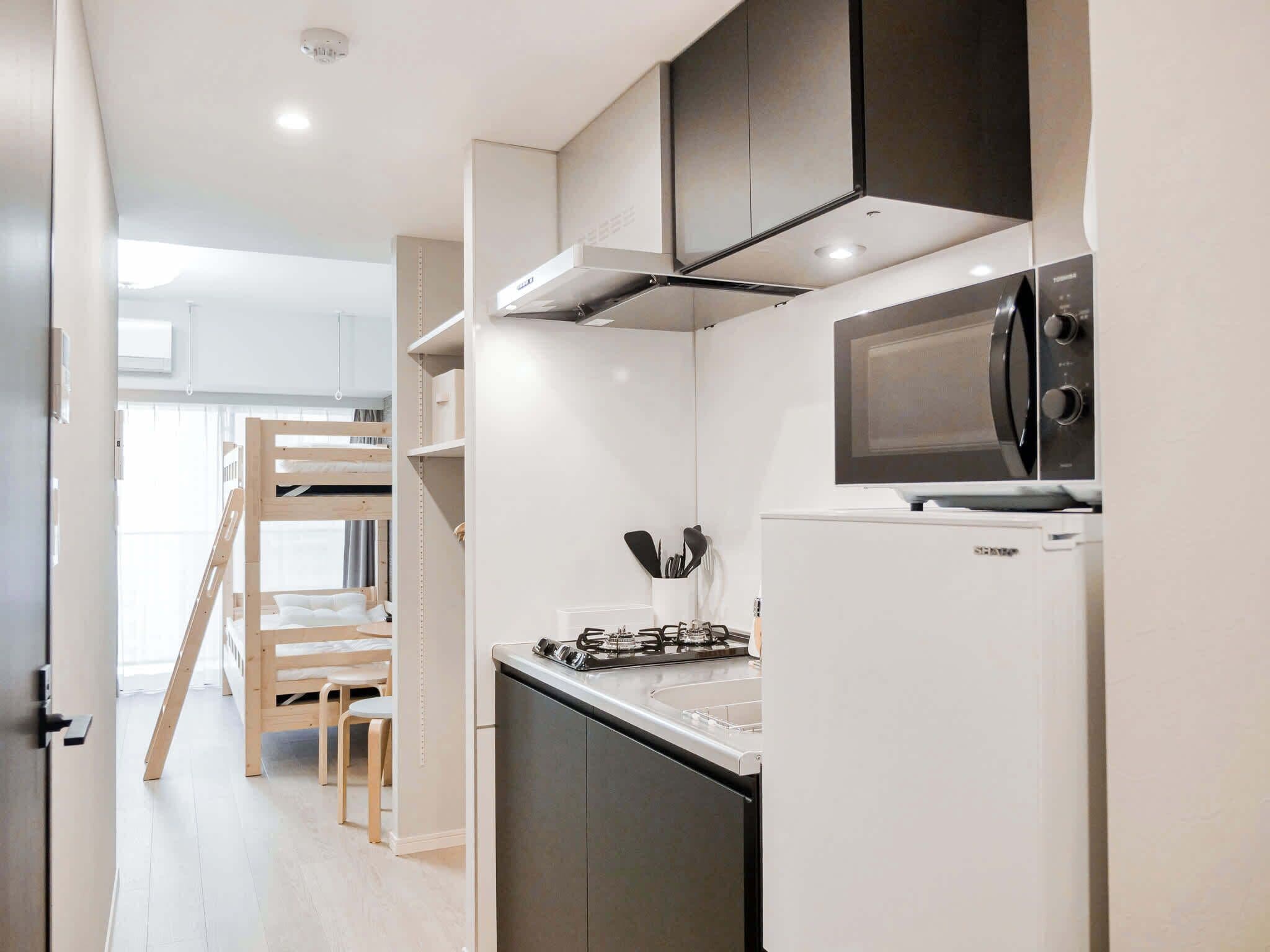 Fridge, microwave, electric kettle, high chair