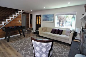 Signature Cabin, 3 Bedrooms, Patio | Living room | 40-inch Smart TV with digital channels, fireplace, foosball