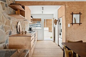 Fridge, stovetop, dishwasher, coffee/tea maker
