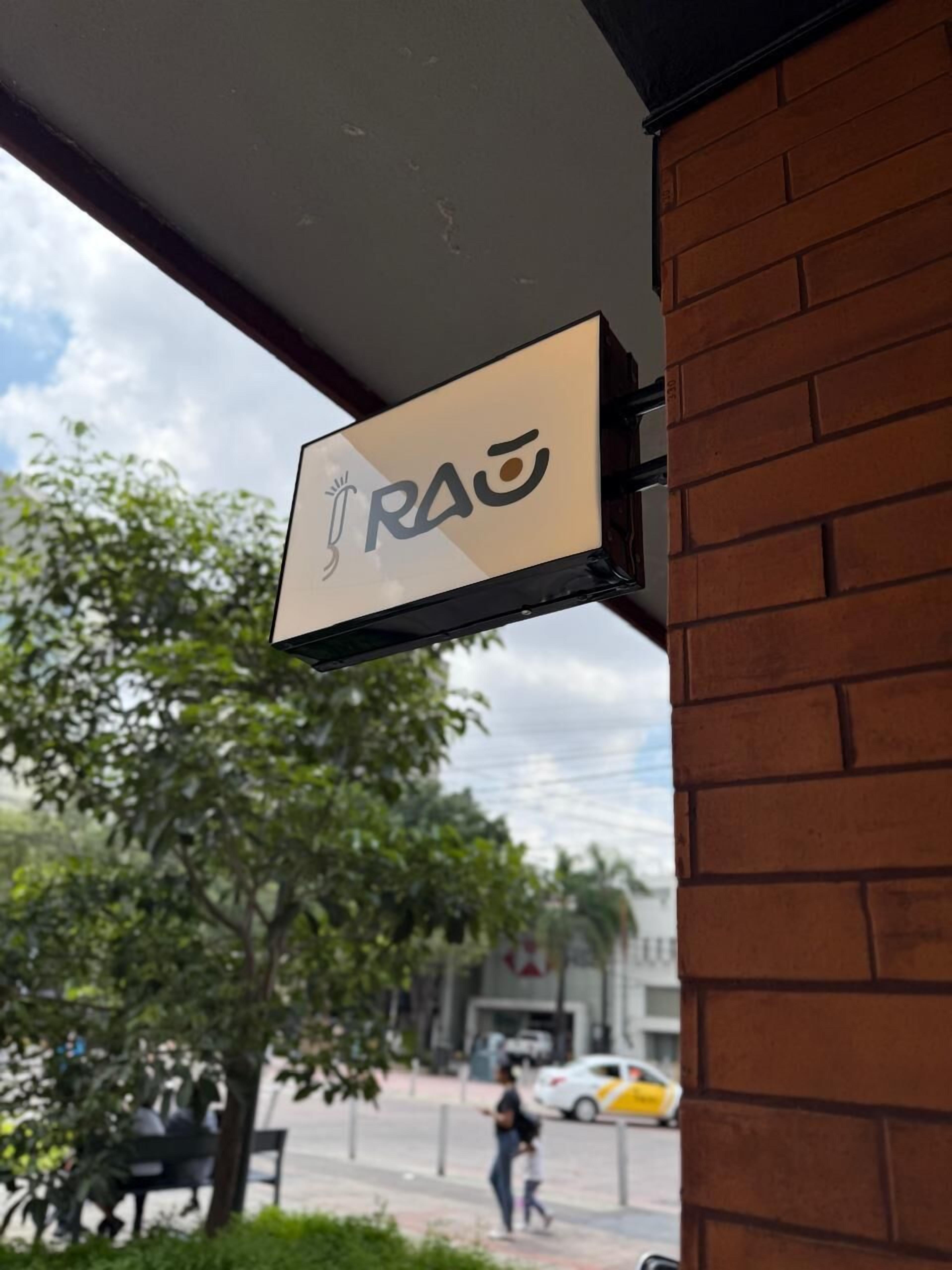 A sign with the word "RAO" on a building facade.
