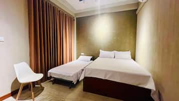 Family Triple Room, Balcony, Garden View | Desk, laptop workspace