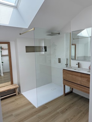 Shower, hair dryer, towels, toilet paper