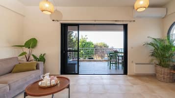 Superior Villa, Sea View | Living area | Flat-screen TV