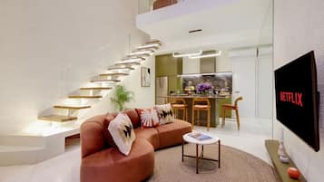 Deluxe-Villa, Balkon, Gartenblick | Wohnbereich
