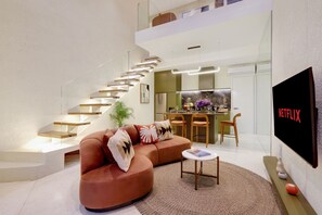 Villa Deluxe, balcón, vista al jardín | Área de sala de estar