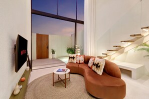 Villa Deluxe, balcón, vista al jardín | Área de sala de estar