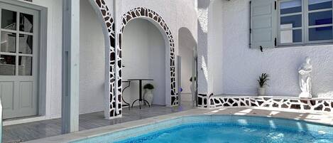 Seasonal outdoor pool, open 9:00 AM to 8:00 PM, sun loungers