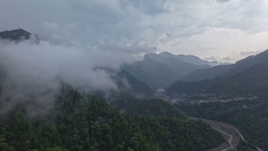 A mountainous landscape with a valley and a road. - Fillow Casa Hills (Narendra Nagar)