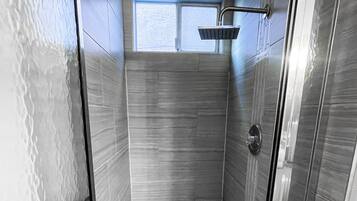 Shower, towels, soap, toilet paper