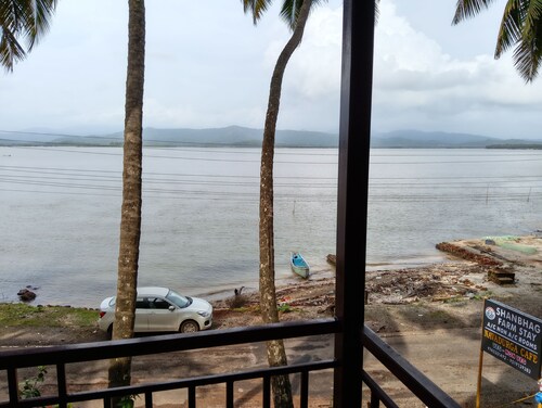 This is river front farm stay 
Morning sunrise is seen inside of the rooms