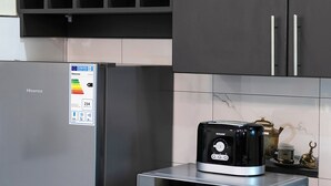 A kitchen with a Hisense refrigerator, a Hisense microwave, and a toaster.