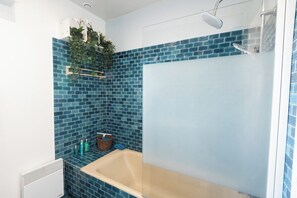 Shower, hair dryer, towels, soap