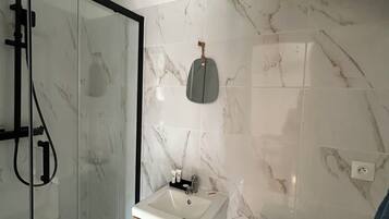 Shower, towels, soap, toilet paper