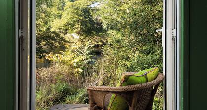 Riverside Cabin in pretty Ettrickbridge, just a short walk to village pub.