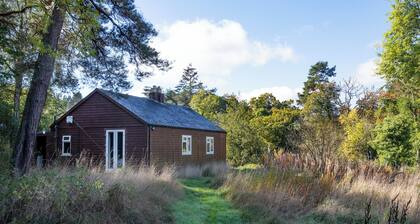 Riverside Cabin in pretty Ettrickbridge, just a short walk to village pub.