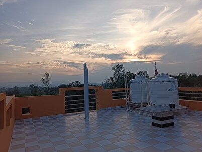 Tranquil Homestay Near Sacred Flames where Comfort Meets Devotion in the Hills.