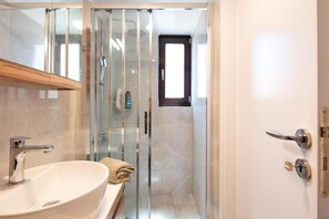 Shower, hair dryer, towels, soap