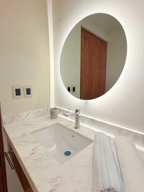 Shower, towels, soap, toilet paper