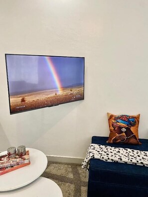 Apartment, Garden View | Living area | 24-inch Smart TV with digital channels - Lux Suites Kiamboni Apartments (Nakuru)