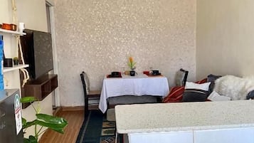 Deluxe Apartment, Garden View | Living area | 24-inch Smart TV with digital channels