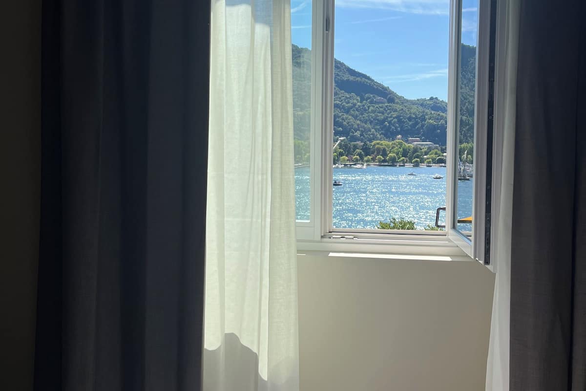 Junior Suite, Lake View | Minibar, in-room safe, desk, laptop workspace