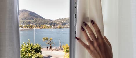 Junior Suite, Lake View | Minibar, in-room safe, desk, laptop workspace