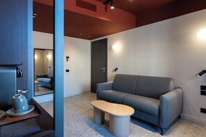 Suite Premium, vue jardin | Coin séjour