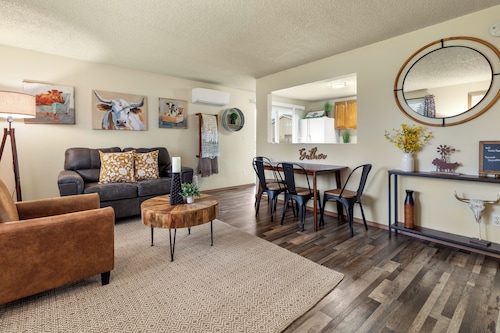 This two bedroom home has a fully fenced yard, air conditioning, fully stocked kitchen, full size washer/dryer and all the modern amenities of home but whimsically decorated with a farmhouse fun vibe!