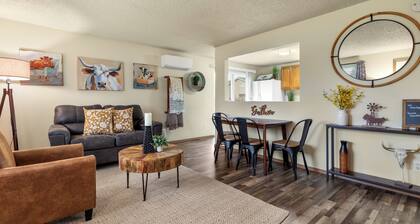 This two bedroom home has a fully fenced yard, air conditioning, fully stocked kitchen, full size washer/dryer and all the modern amenities of home but whimsically decorated with a farmhouse fun vibe!