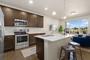 Townhome, Multiple Beds, Patio, Garden View (926 Schlagel St. (unit 2)) | Private kitchen | Fridge, microwave, oven, stovetop - Northfield Hideaway, King Suite, EV, Pet-friendly (Fort Collins)