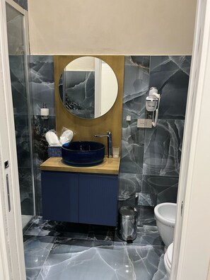 Deluxe Triple Room, Balcony, City View | Bathroom | Shower, rainfall showerhead, free toiletries, hair dryer