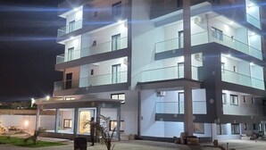 A multi-story building with balconies and large windows, likely a hotel or apartment complex. - Melia's Hôtel Diamniadio  (Diamniadio)