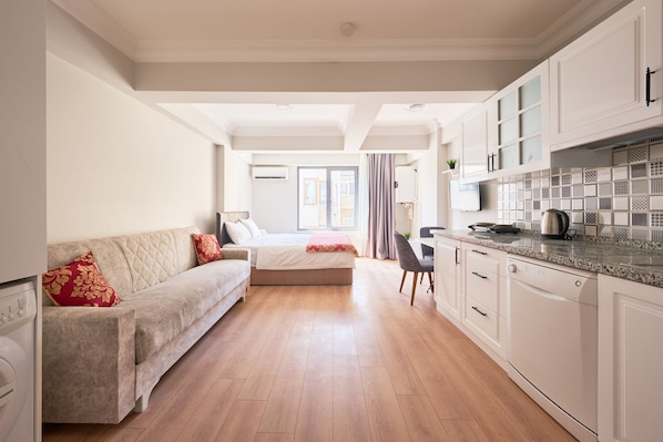 Deluxe Condo, City View | Desk, laptop workspace, iron/ironing board, free WiFi