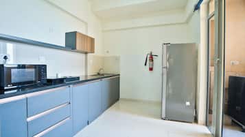 Fridge, microwave, electric kettle, dining tables