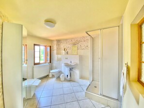 Shower, hair dryer, towels, soap